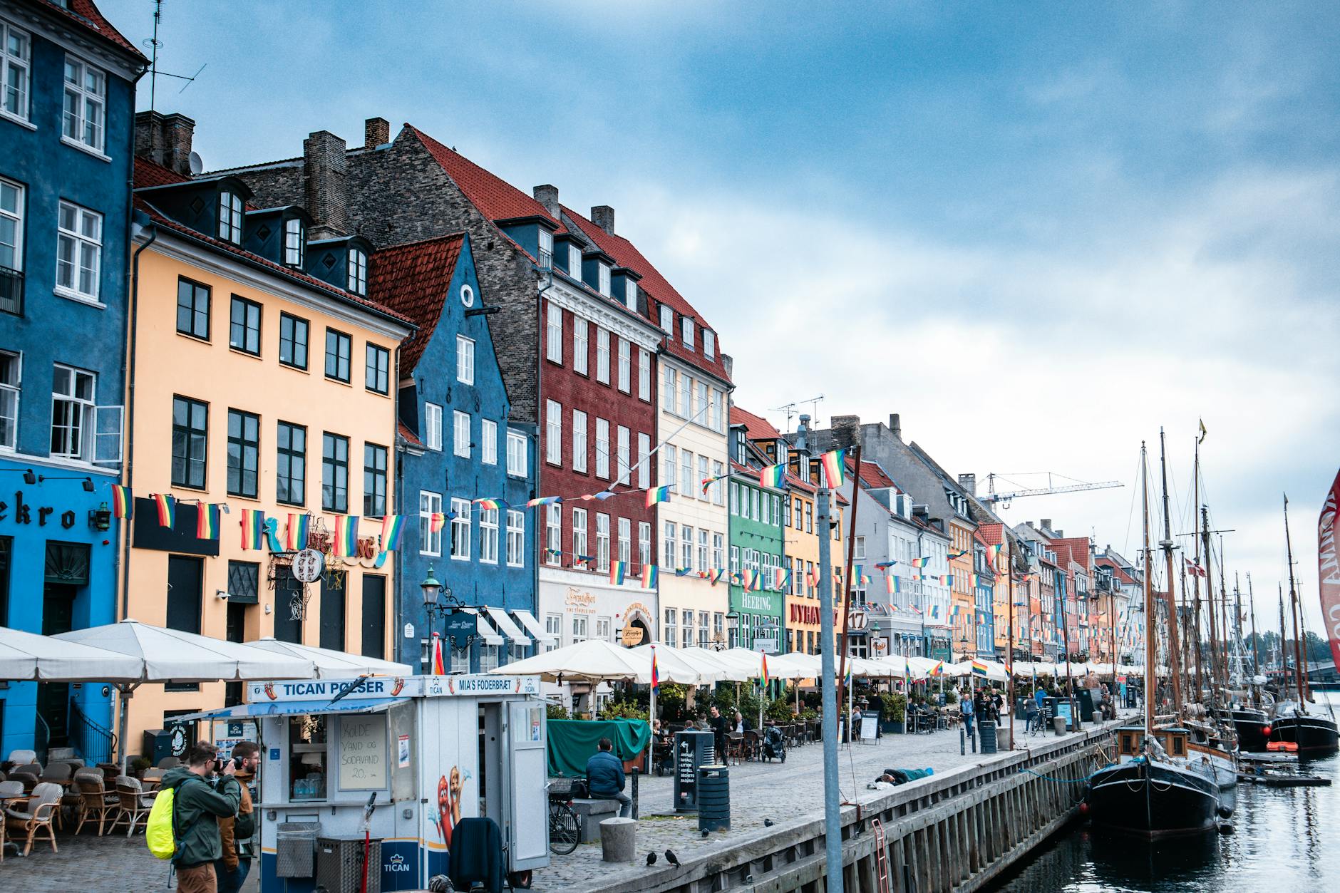 Vibrant buildings and boats line the picturesque Nyhavn waterfront in Copenhagen.